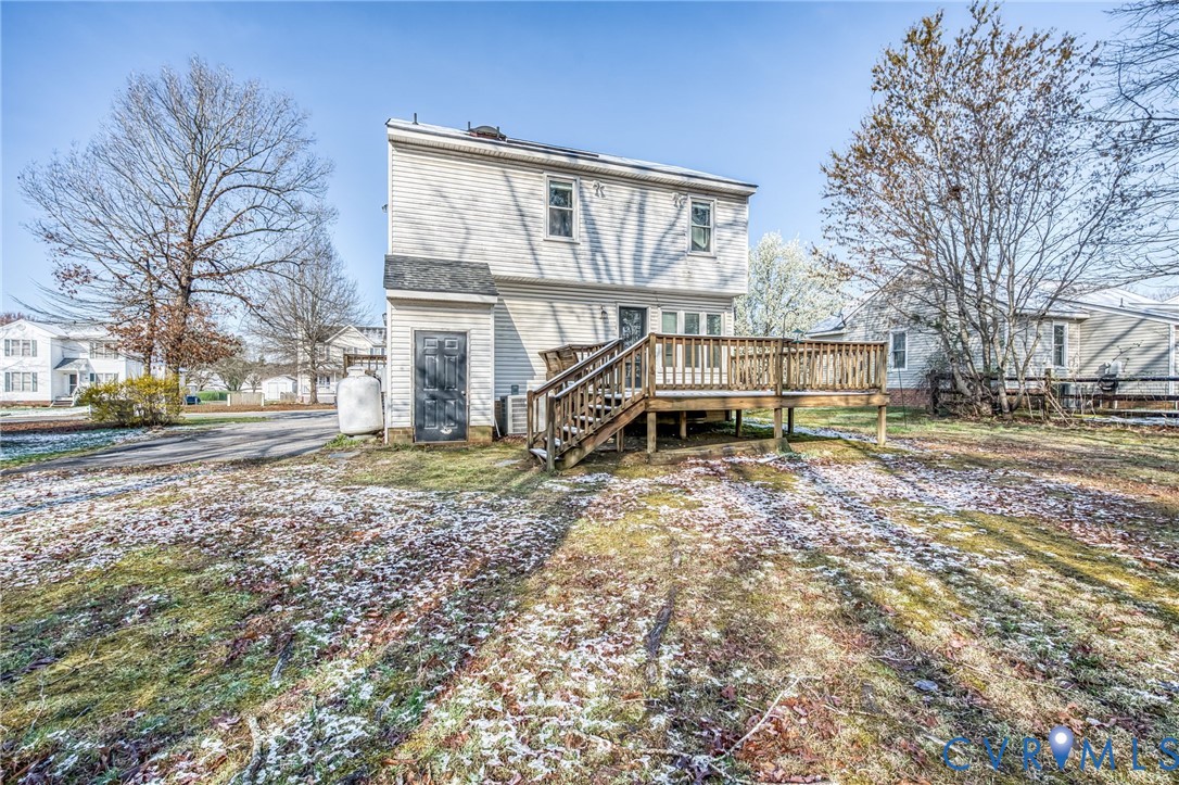 9301 Brocket Drive Midlothian, VA 23112 - Photo 27 of 27 a view of a house with backyard and trees