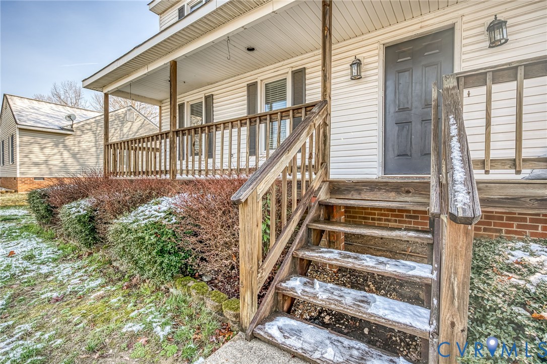 9301 Brocket Drive Midlothian, VA 23112 - Photo 4 of 27 a view of staircase with wooden floor and a rug