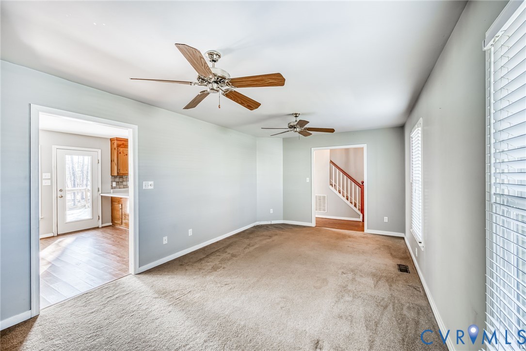 9301 Brocket Drive Midlothian, VA 23112 - Photo 8 of 27 wooden floor in an empty room with a window