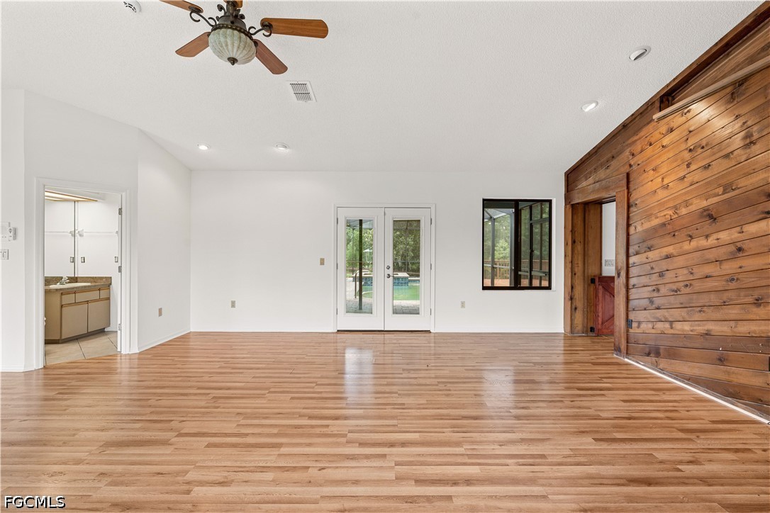 27255 Hickory Hill Road Brooksville, FL 34602 - Photo 29 of 50 a view of empty room with wooden floor and fan