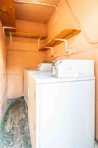 a view of a park with wooden fence