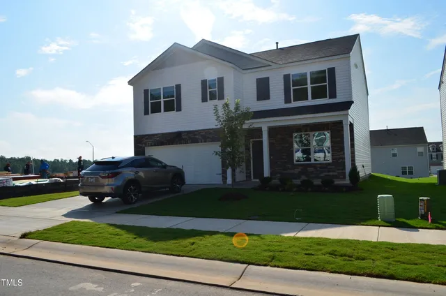 a house view with a garden space