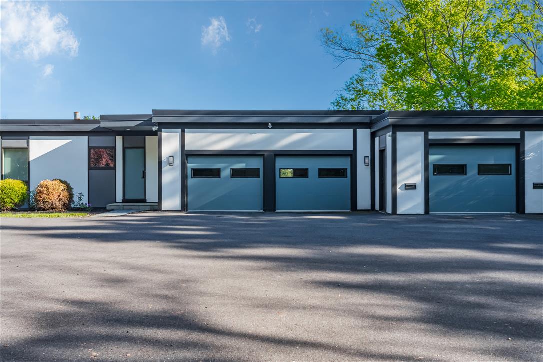 1506 Pleasant View Road Coopersburg, PA 18036 - Photo 5 of 97 A contemporary exterior features sleek lines, a welcoming entry, and ample parking space.