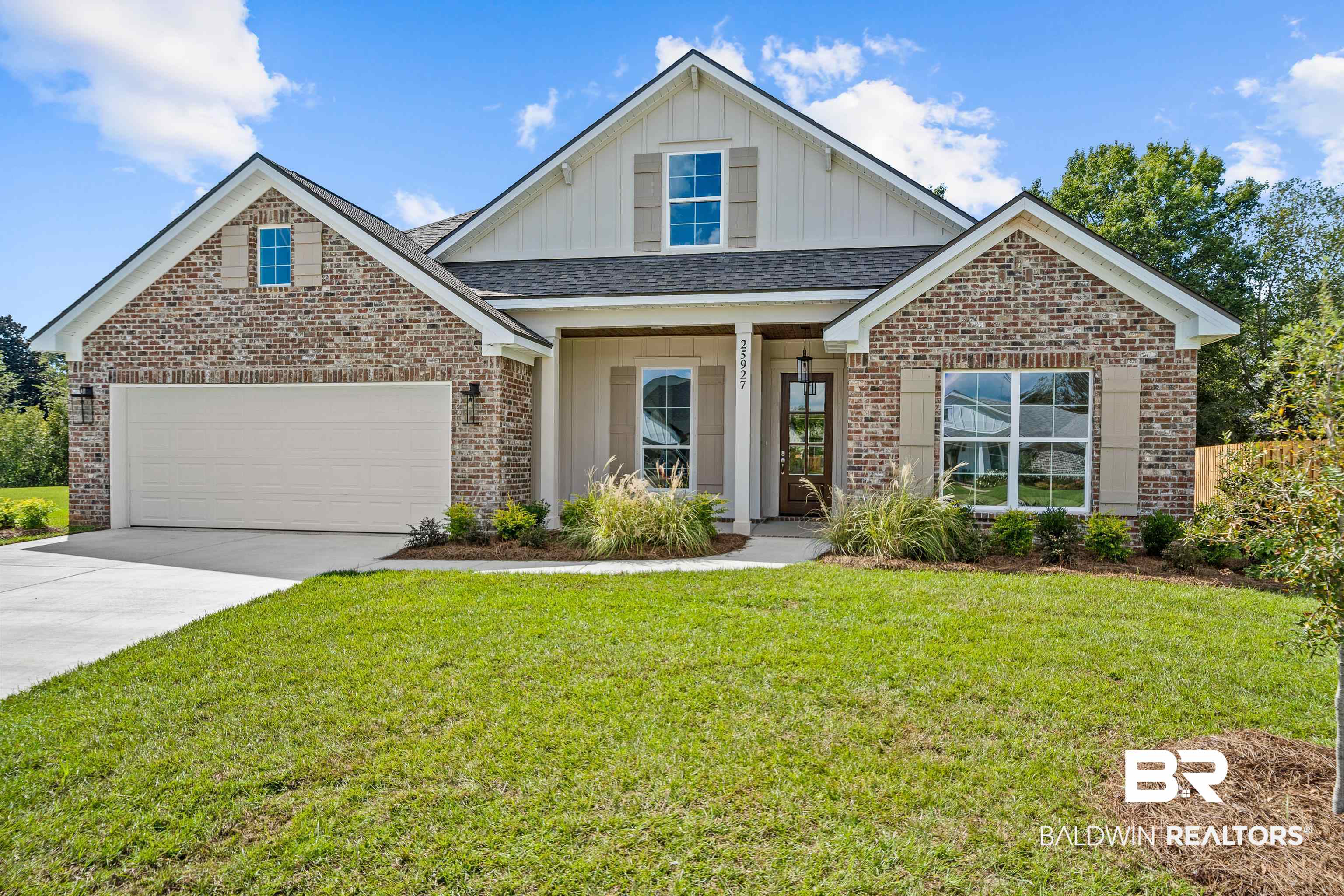 25927 Capra Court Daphne, AL 36526 - Photo 2 of 37 View of front of house with a front lawn and a garage