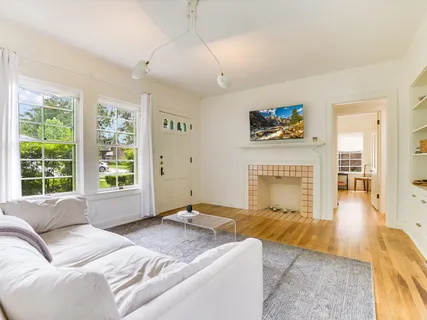 a spacious bedroom with a bed and a large window