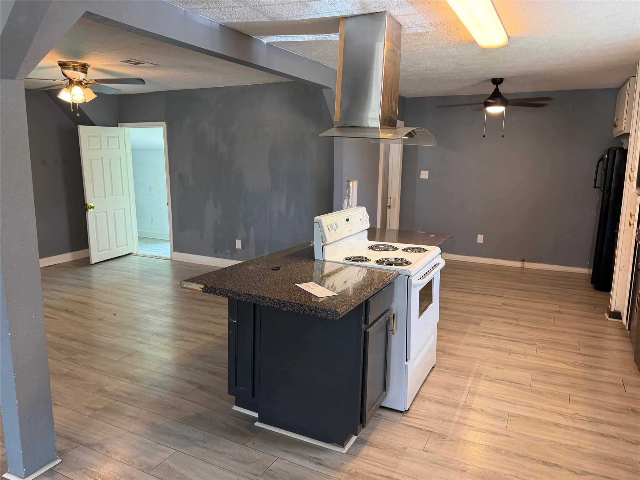 1401 East 29th Street Bryan, TX 77802 - Photo 7 of 13 A functional kitchen with a central island and modern appliances awaits culinary creativity.