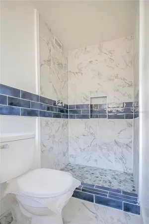 a bathroom with a toilet and a sink