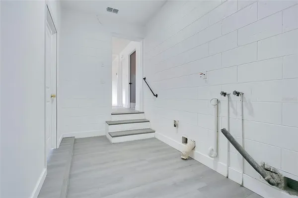 a view of entryway with stairs and wooden floor