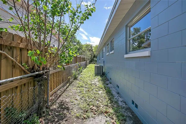 a view of a pathway of a house with wooden floor