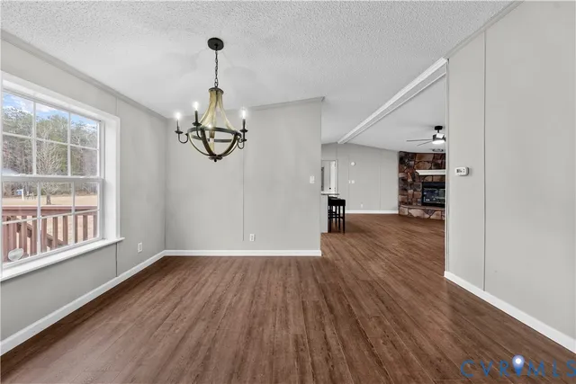 a view of a yard covered with snow in front of house