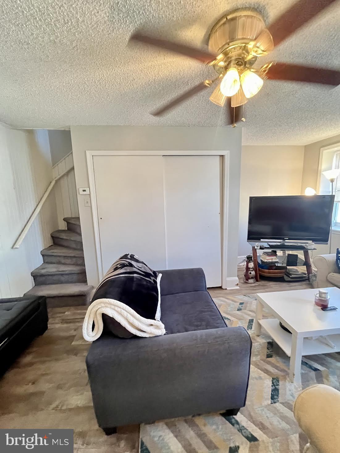 125 Maple Street Conshohocken, PA 19428 - Photo 11 of 32 a living room with furniture and a flat screen tv