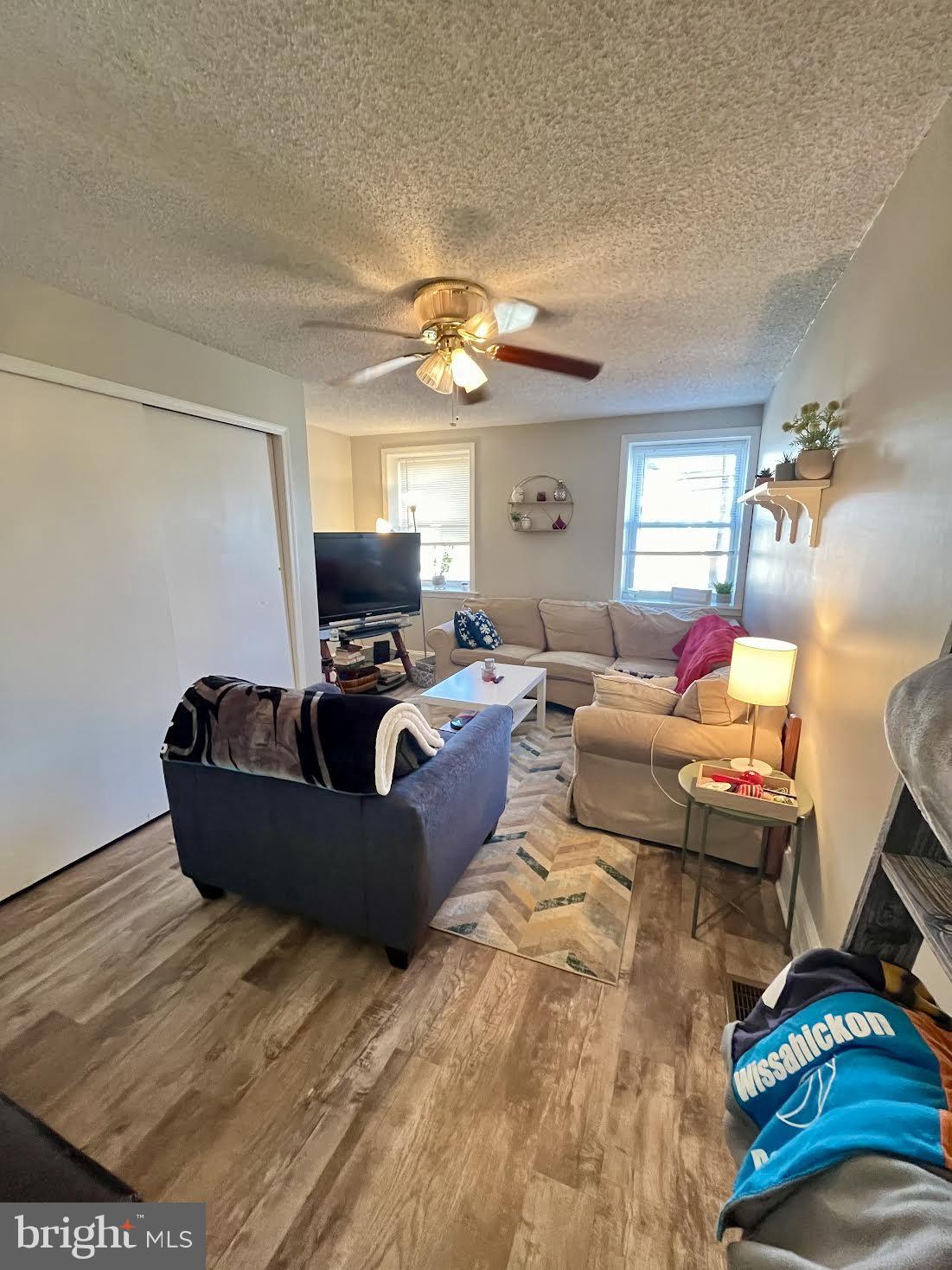 125 Maple Street Conshohocken, PA 19428 - Photo 13 of 32 a living room with furniture and a flat screen tv