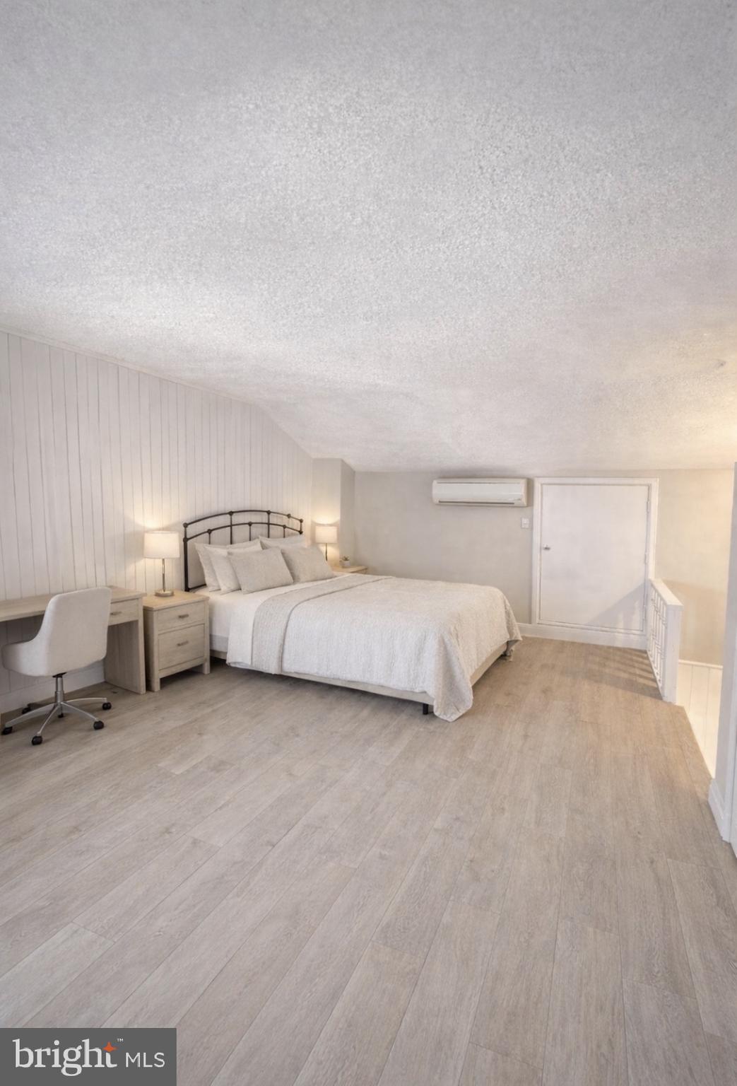 125 Maple Street Conshohocken, PA 19428 - Photo 14 of 20 a view of a bedroom with a bed and lamp