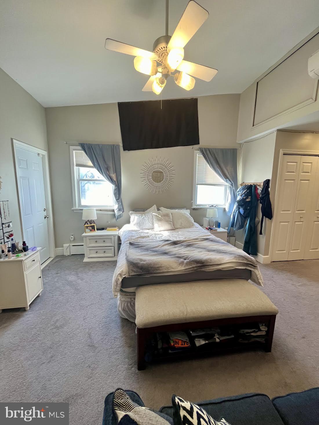 125 Maple Street Conshohocken, PA 19428 - Photo 18 of 32 a bedroom with a bed and a chandelier