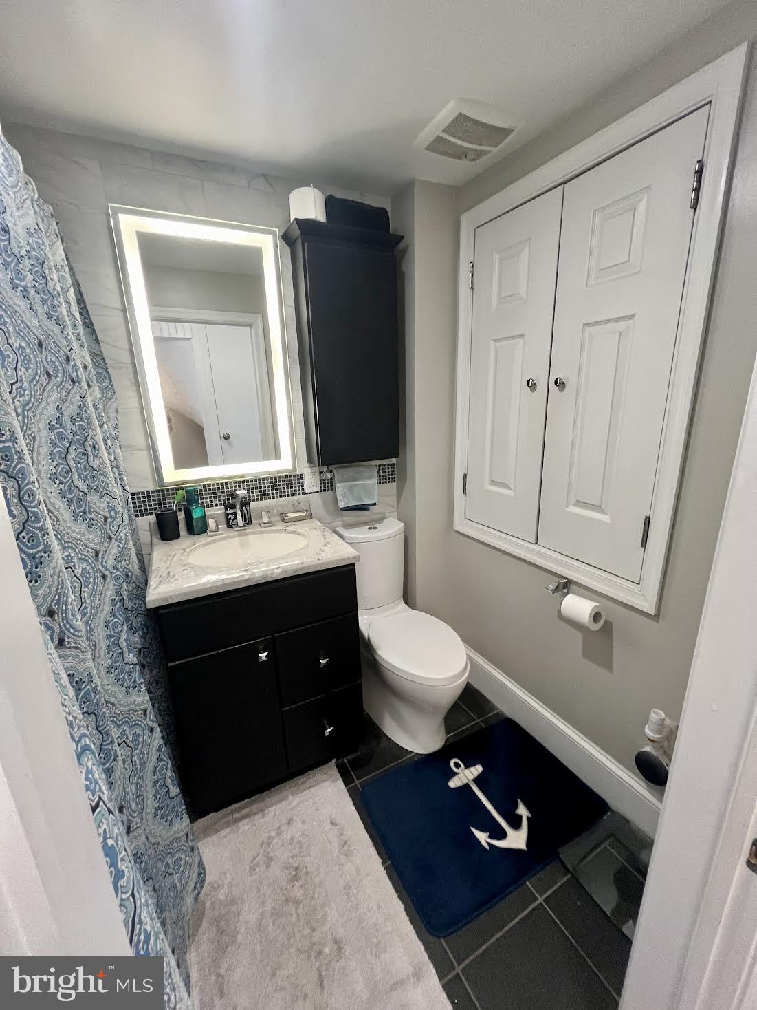 125 Maple Street Conshohocken, PA 19428 - Photo 20 of 32 a bathroom with a sink toilet and mirror