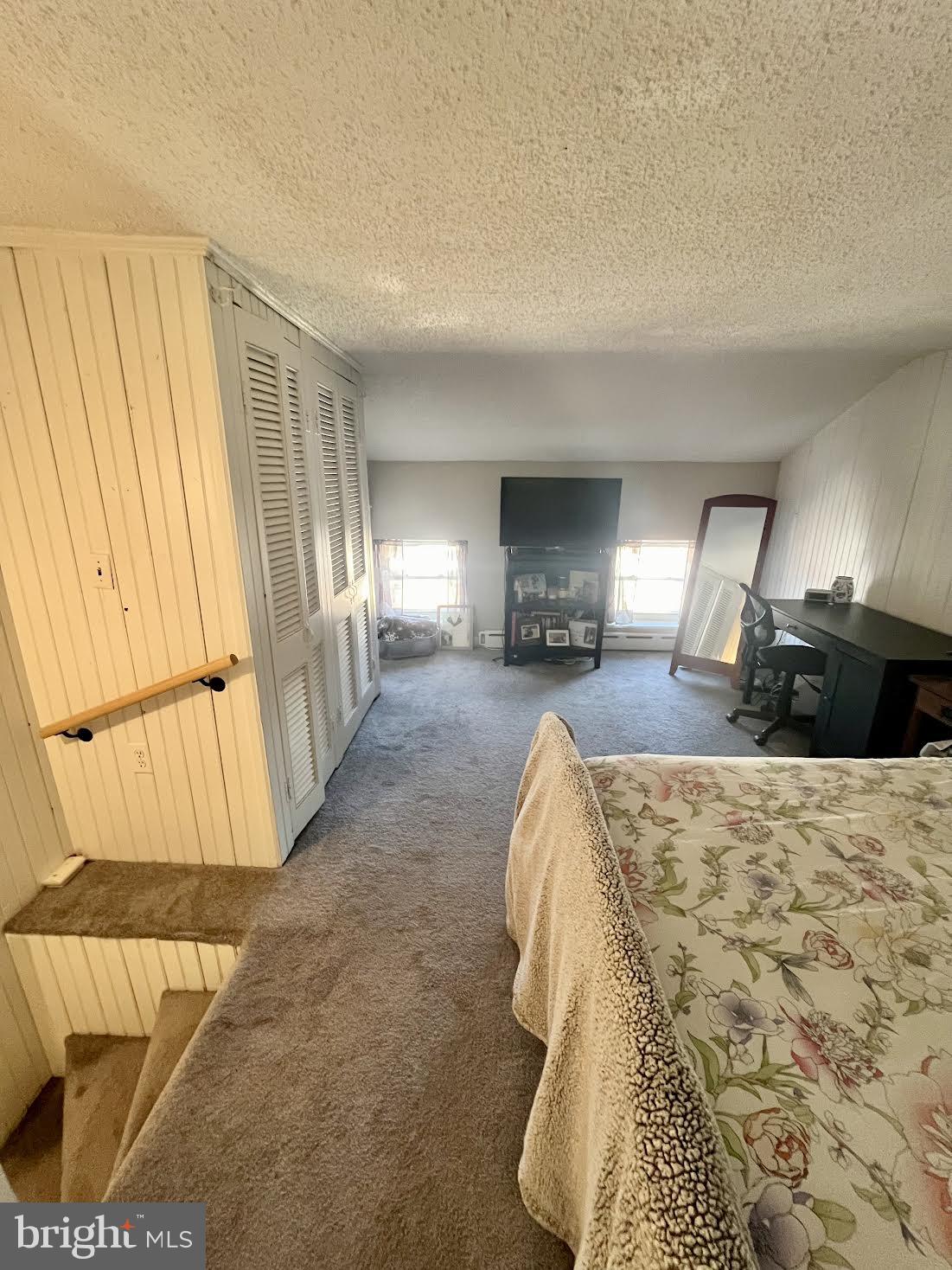 125 Maple Street Conshohocken, PA 19428 - Photo 27 of 32 a bed room with a bed and a chair