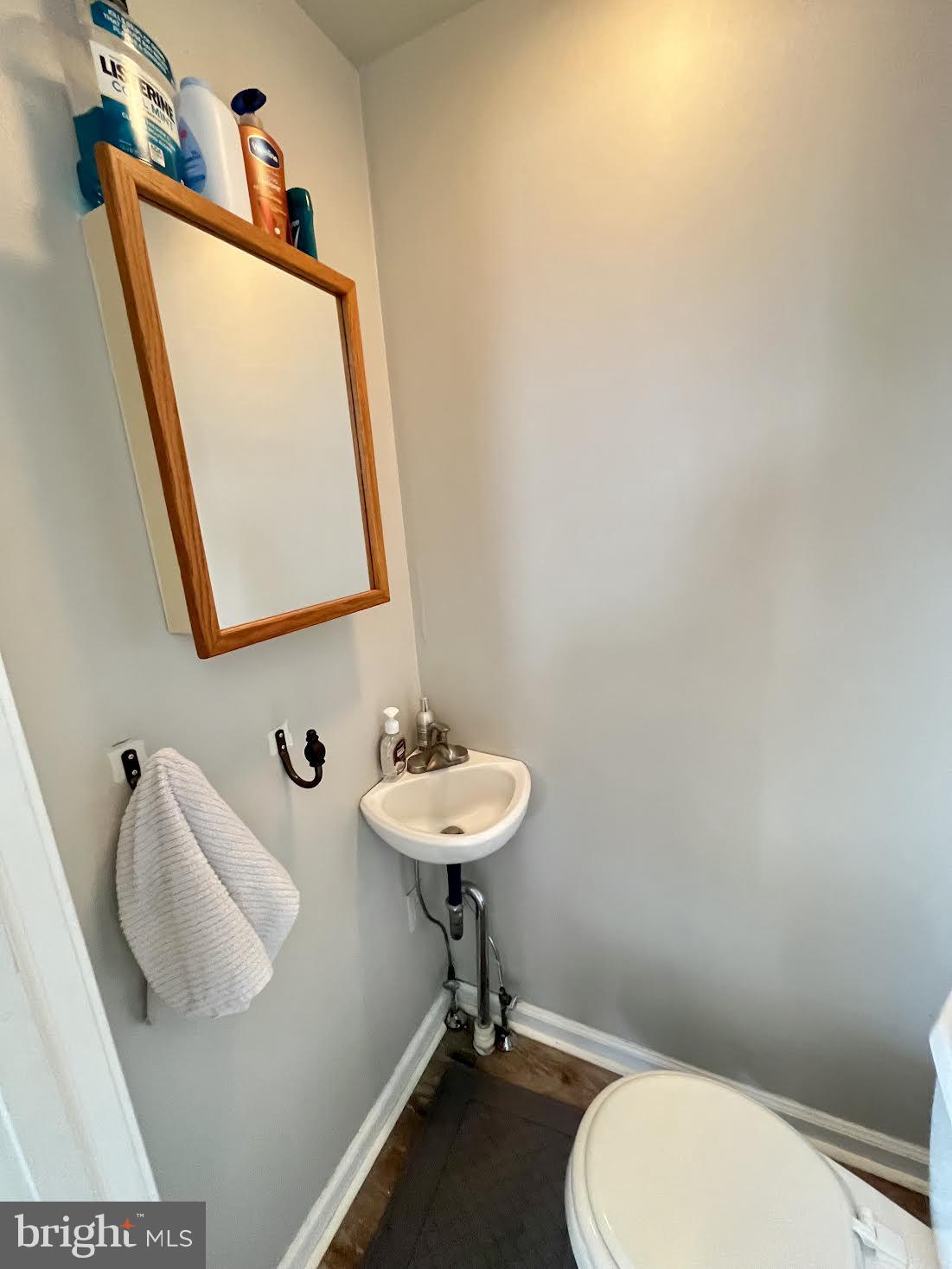 125 Maple Street Conshohocken, PA 19428 - Photo 4 of 32 a bathroom with a toilet sink and mirror