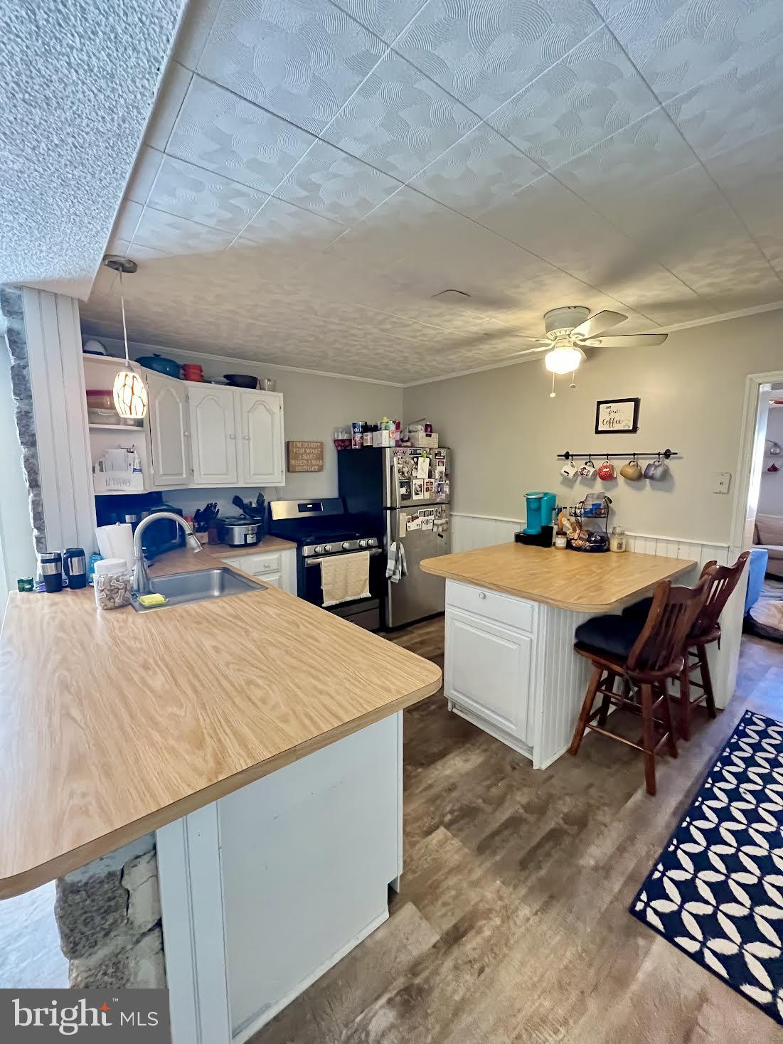 125 Maple Street Conshohocken, PA 19428 - Photo 6 of 32 a living room with stainless steel appliances kitchen island granite countertop furniture and a kitchen view
