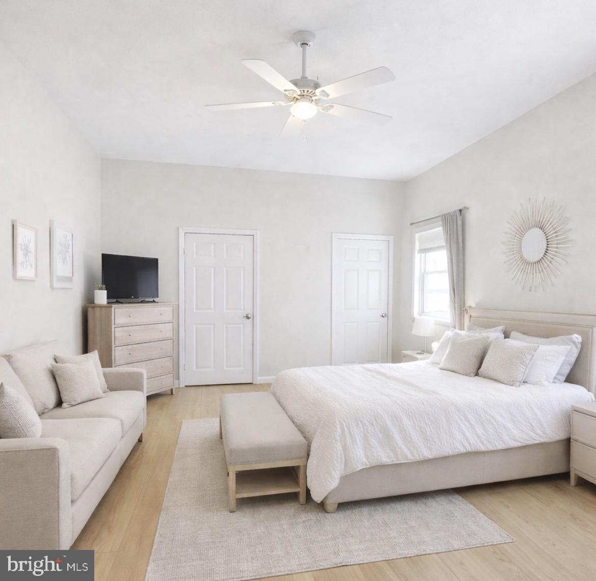 125 Maple Street Conshohocken, PA 19428 - Photo 9 of 20 a bedroom with a bed couch and window