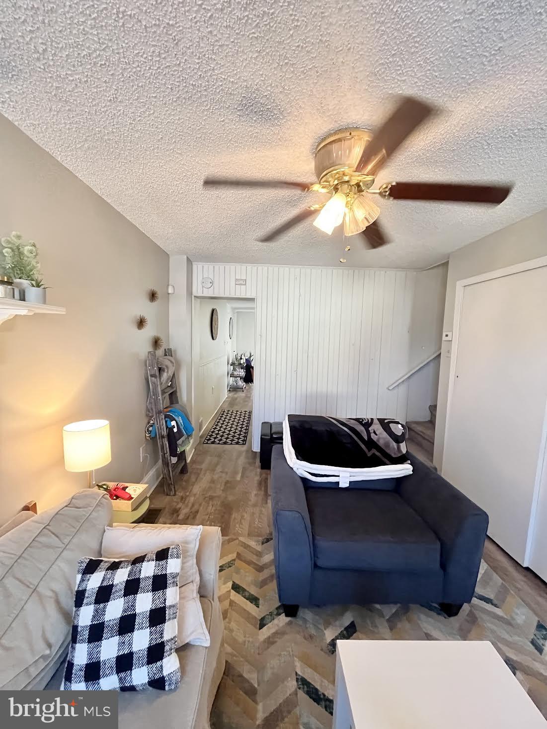 125 Maple Street Conshohocken, PA 19428 - Photo 10 of 32 a living room with a couch and a chandelier