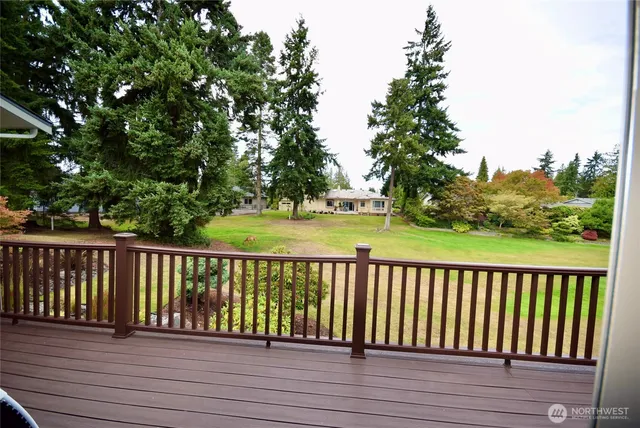 a view of wooden deck and a garden