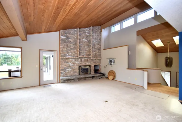 a view of a livingroom with furniture and a fireplace