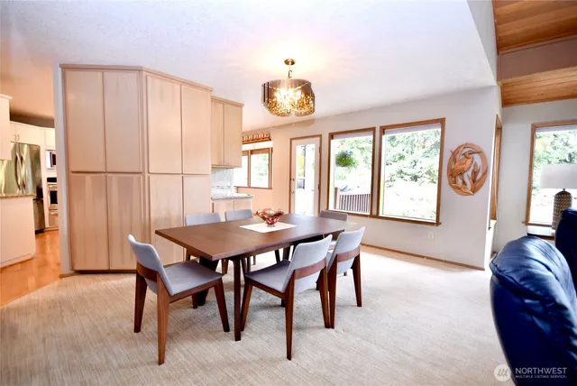 a view of a dining room with furniture window and outside view
