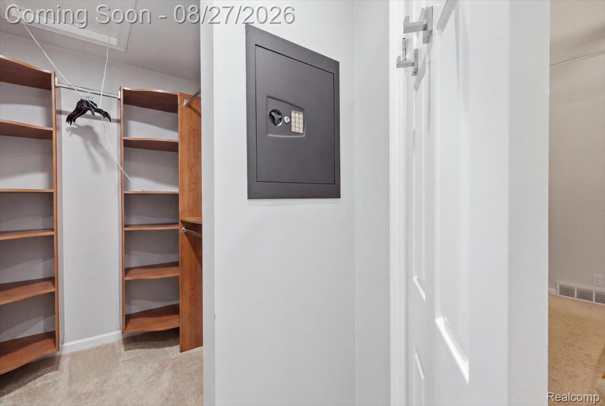 10100 Springtime Circle Clarkston, MI 48348 - Photo 38 of 73 Walk-in closet with custom shelving and hanging rods