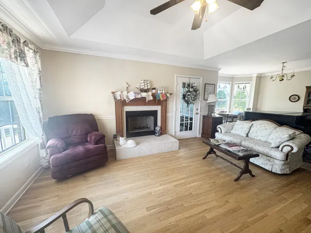 a living room with furniture and a fireplace
