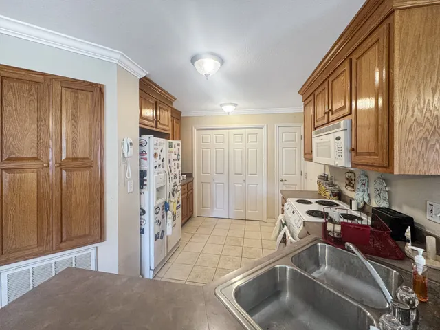 a view of a kitchen with a sink and cabinets