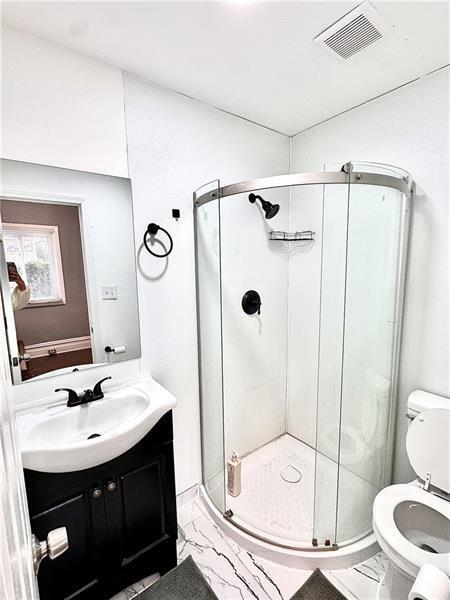 94 Lafferty Avenue Pittsburgh, PA 15210 - Photo 14 of 17 a bathroom with a sink toilet and shower