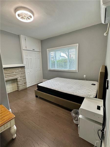 94 Lafferty Avenue Pittsburgh, PA 15210 - Photo 16 of 17 a bedroom with bed and a window
