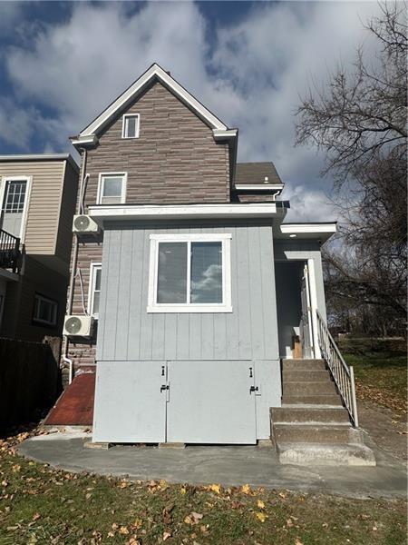 94 Lafferty Avenue Pittsburgh, PA 15210 - Photo 2 of 17 a front view of a house with a yard