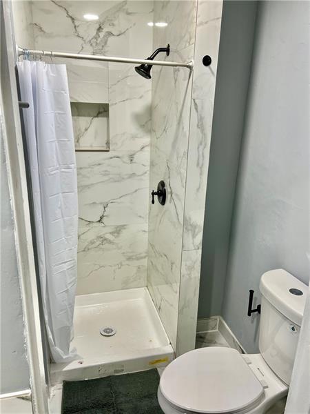 94 Lafferty Avenue Pittsburgh, PA 15210 - Photo 6 of 17 a bathroom with a sink and a mirror