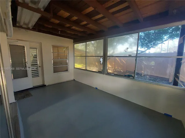 a view of an empty room with a sliding door