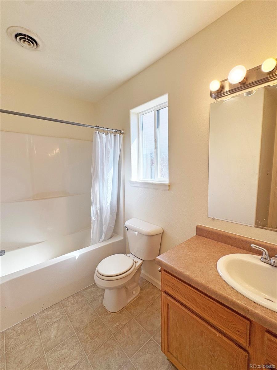 1041 Halfturn Road Rangely, CO 81648 - Photo 11 of 11 a bathroom with a sink a toilet and shower