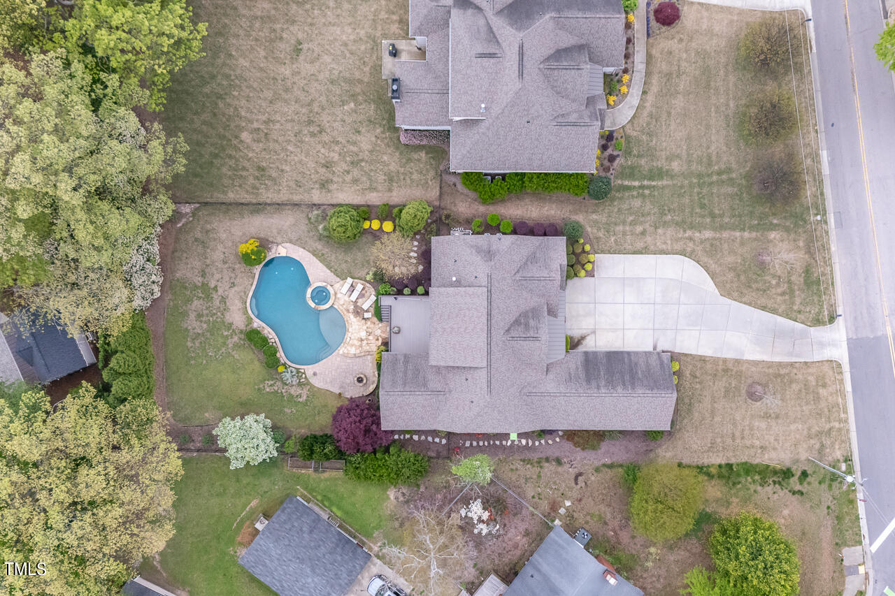 3601 Laurel Hills Road Raleigh, NC 27612 - Photo 1 of 77 an aerial view of a house with a swimming pool