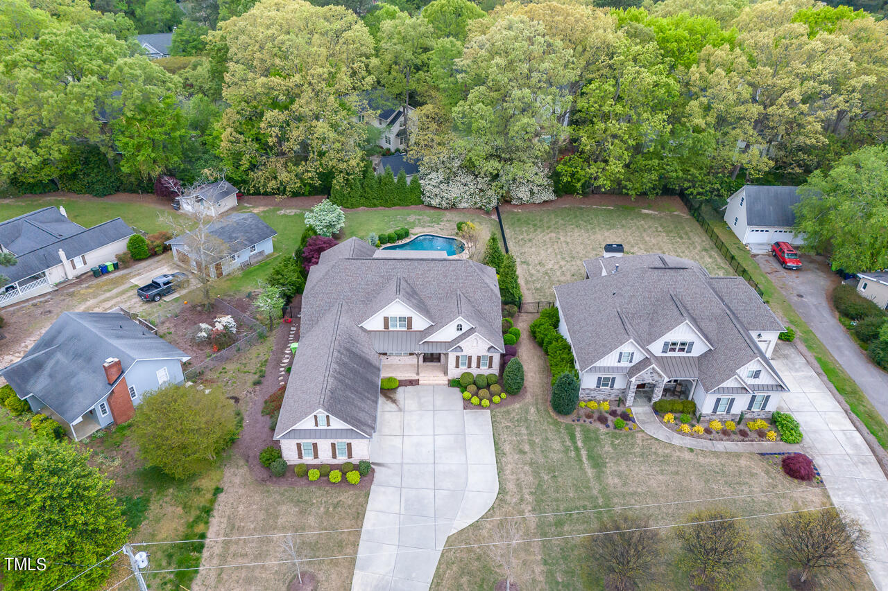 3601 Laurel Hills Road Raleigh, NC 27612 - Photo 13 of 77 an aerial view of residential houses with outdoor space