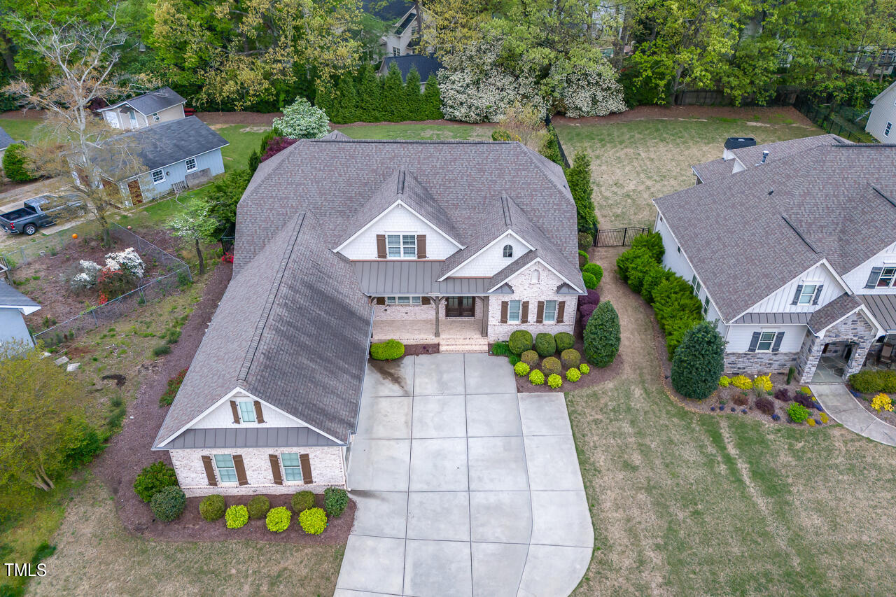 3601 Laurel Hills Road Raleigh, NC 27612 - Photo 16 of 77 an aerial view of a house with garden space and street view