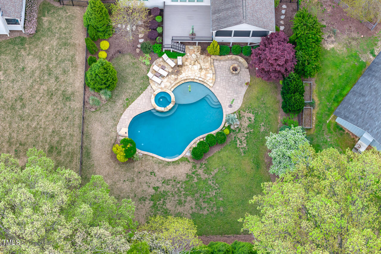 3601 Laurel Hills Road Raleigh, NC 27612 - Photo 2 of 77 an aerial view of a house with a swimming pool and garden