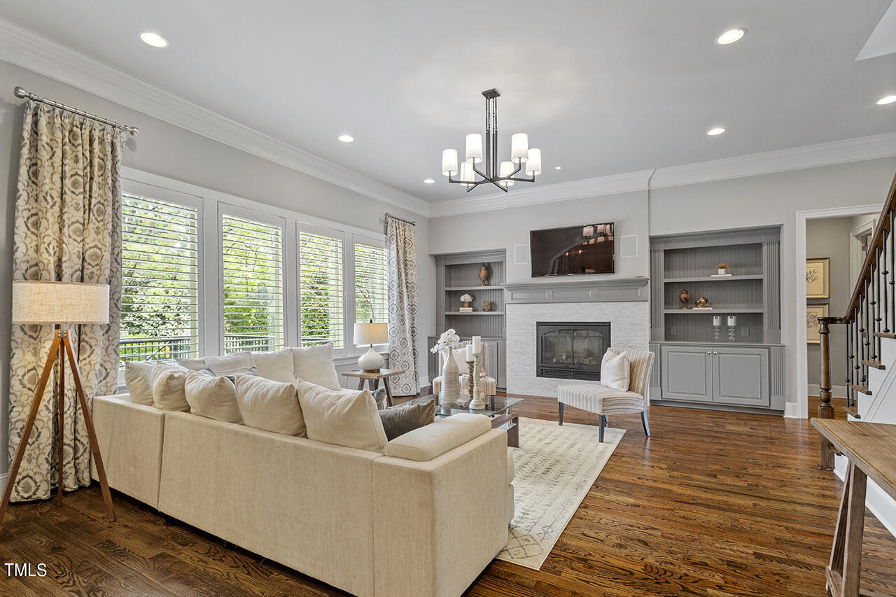 3601 Laurel Hills Road Raleigh, NC 27612 - Photo 22 of 77 a living room with furniture fireplace and flat screen tv