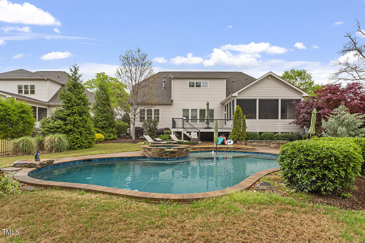 3601 Laurel Hills Road Raleigh, NC 27612 - Photo 4 of 77 a view of a house with swimming pool and a yard