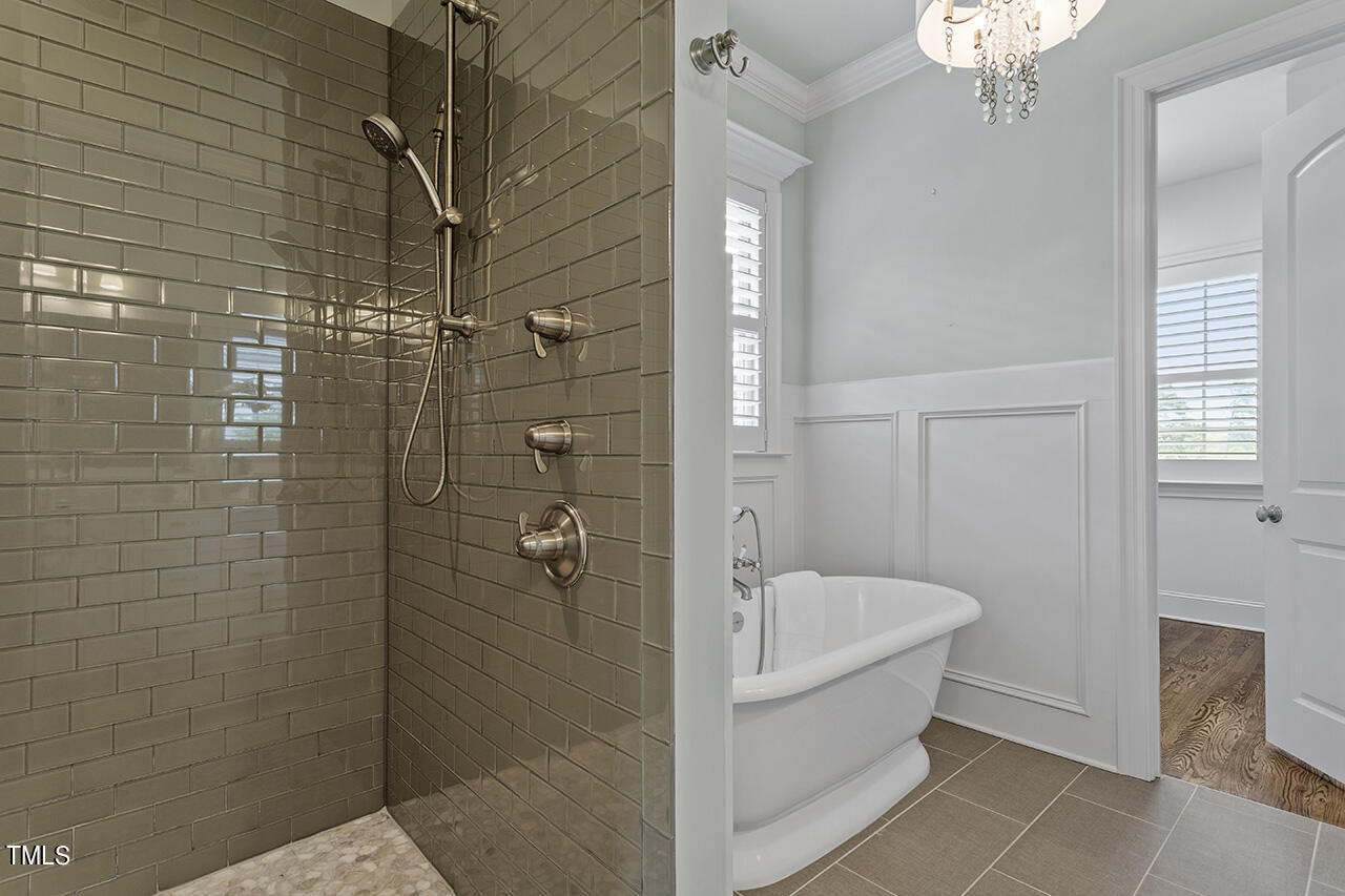 3601 Laurel Hills Road Raleigh, NC 27612 - Photo 43 of 77 a bathroom with a bathtub and shower