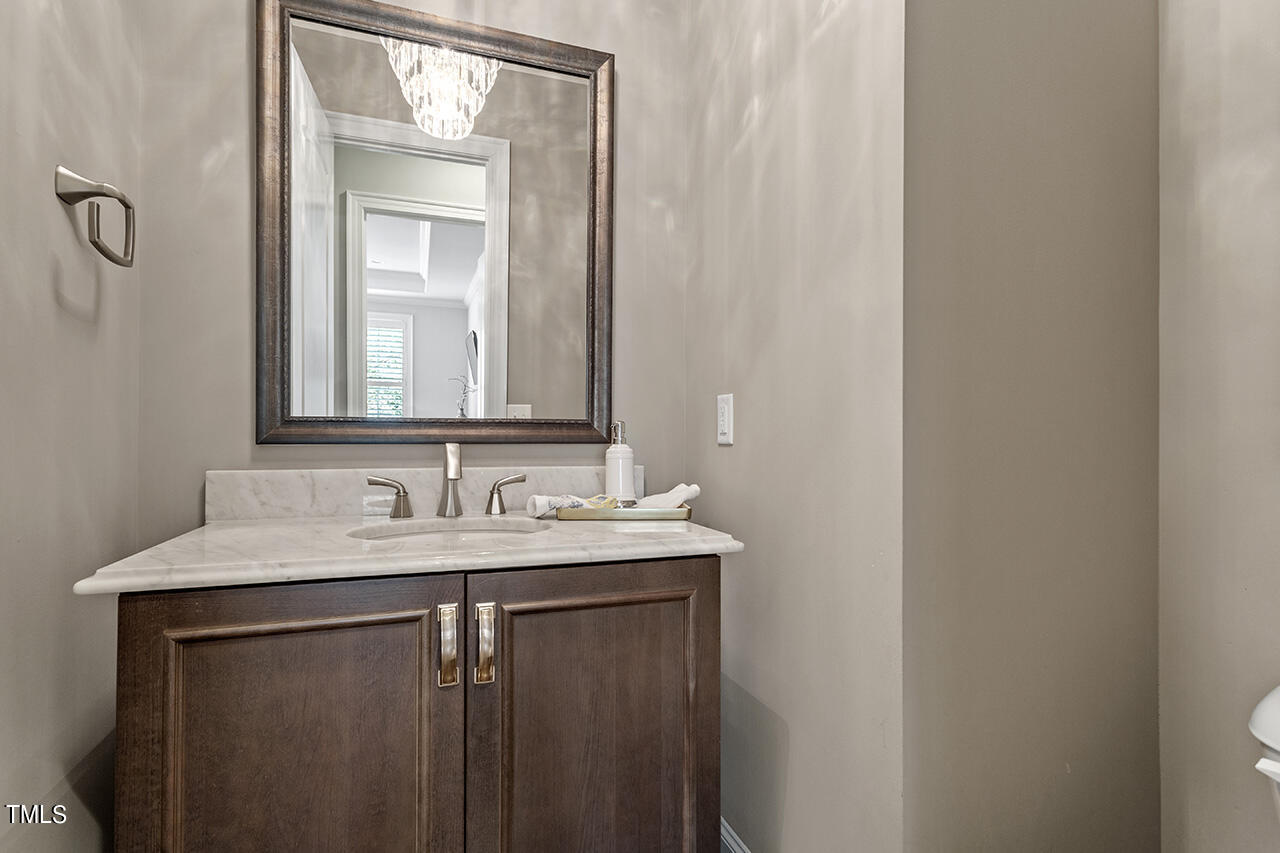 3601 Laurel Hills Road Raleigh, NC 27612 - Photo 45 of 77 a bathroom with a sink and a mirror