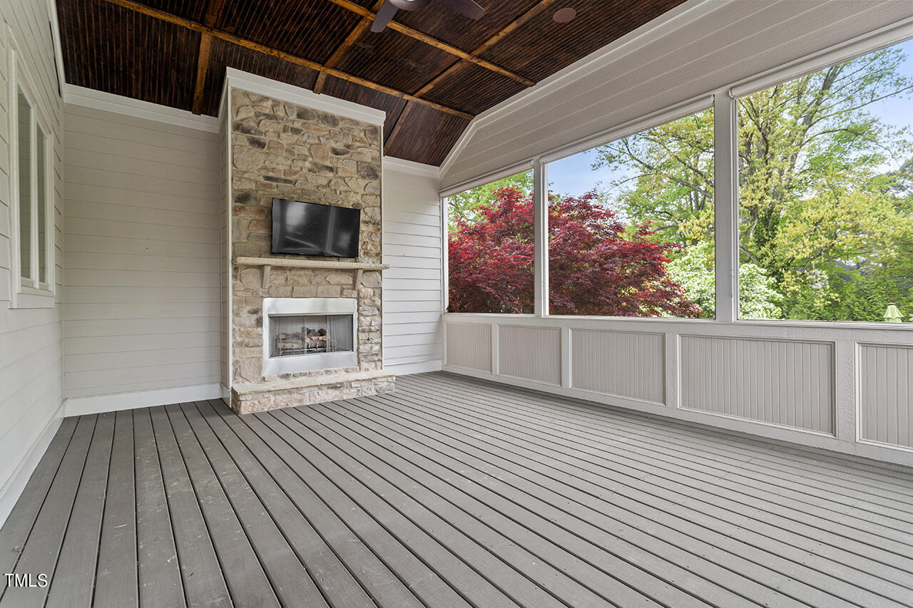 3601 Laurel Hills Road Raleigh, NC 27612 - Photo 49 of 77 a view of an empty room with a window and wooden floor