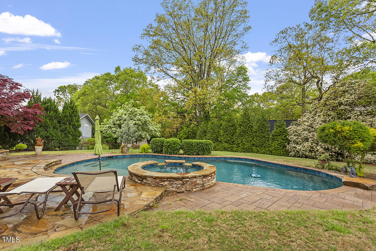 3601 Laurel Hills Road Raleigh, NC 27612 - Photo 5 of 77 a view of a swimming pool with a yard
