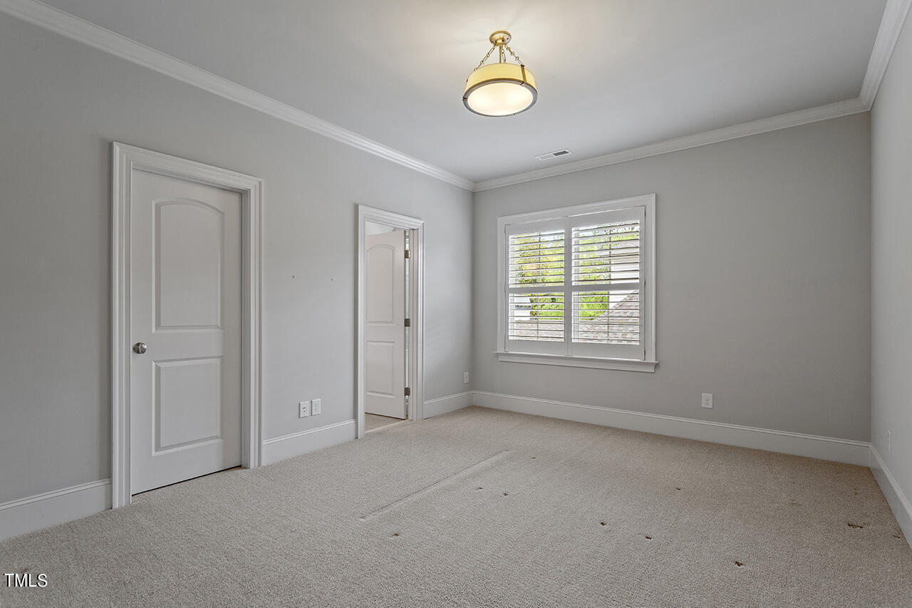 3601 Laurel Hills Road Raleigh, NC 27612 - Photo 53 of 77 a view of an empty room with a window