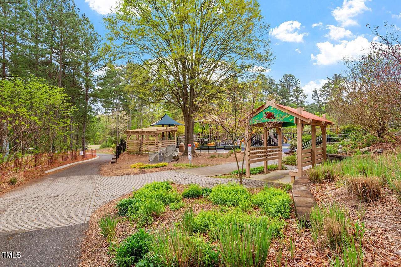 3601 Laurel Hills Road Raleigh, NC 27612 - Photo 60 of 77 a view of swimming pool with sitting area and garden