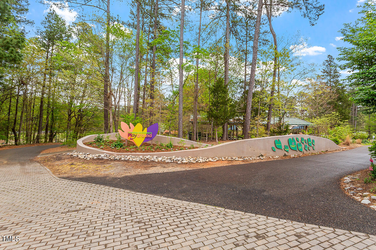 3601 Laurel Hills Road Raleigh, NC 27612 - Photo 64 of 77 a view of a house with a yard and tree s
