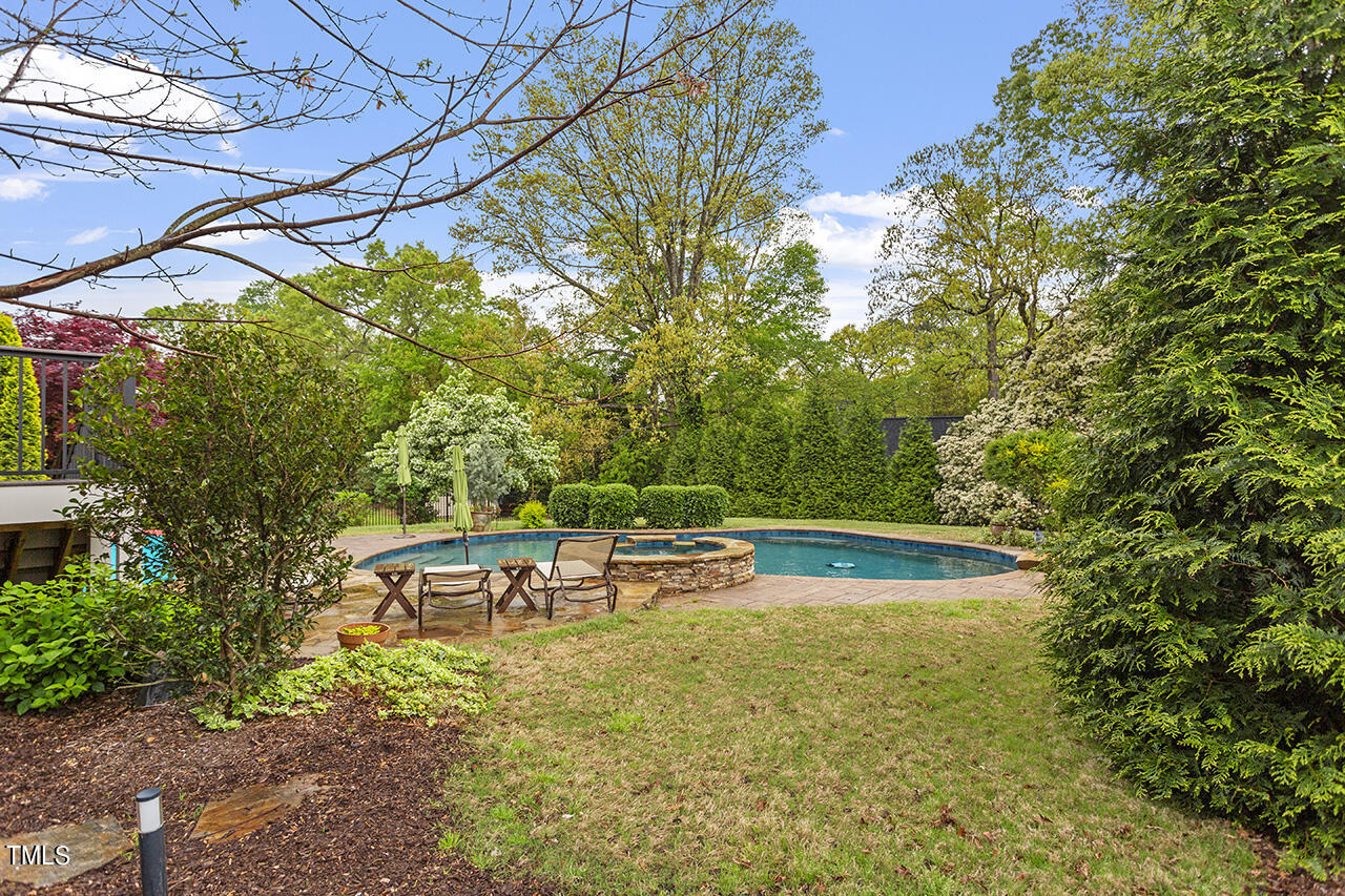 3601 Laurel Hills Road Raleigh, NC 27612 - Photo 72 of 77 a view of a swimming pool with a patio